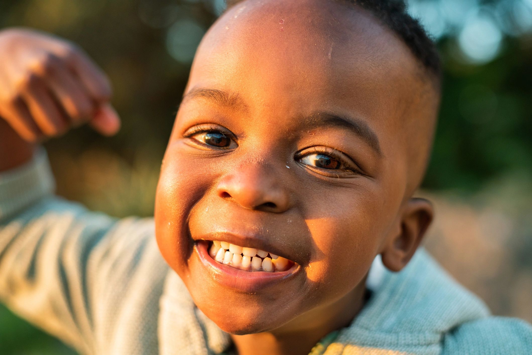 Smiling child outdoors in a rural setting