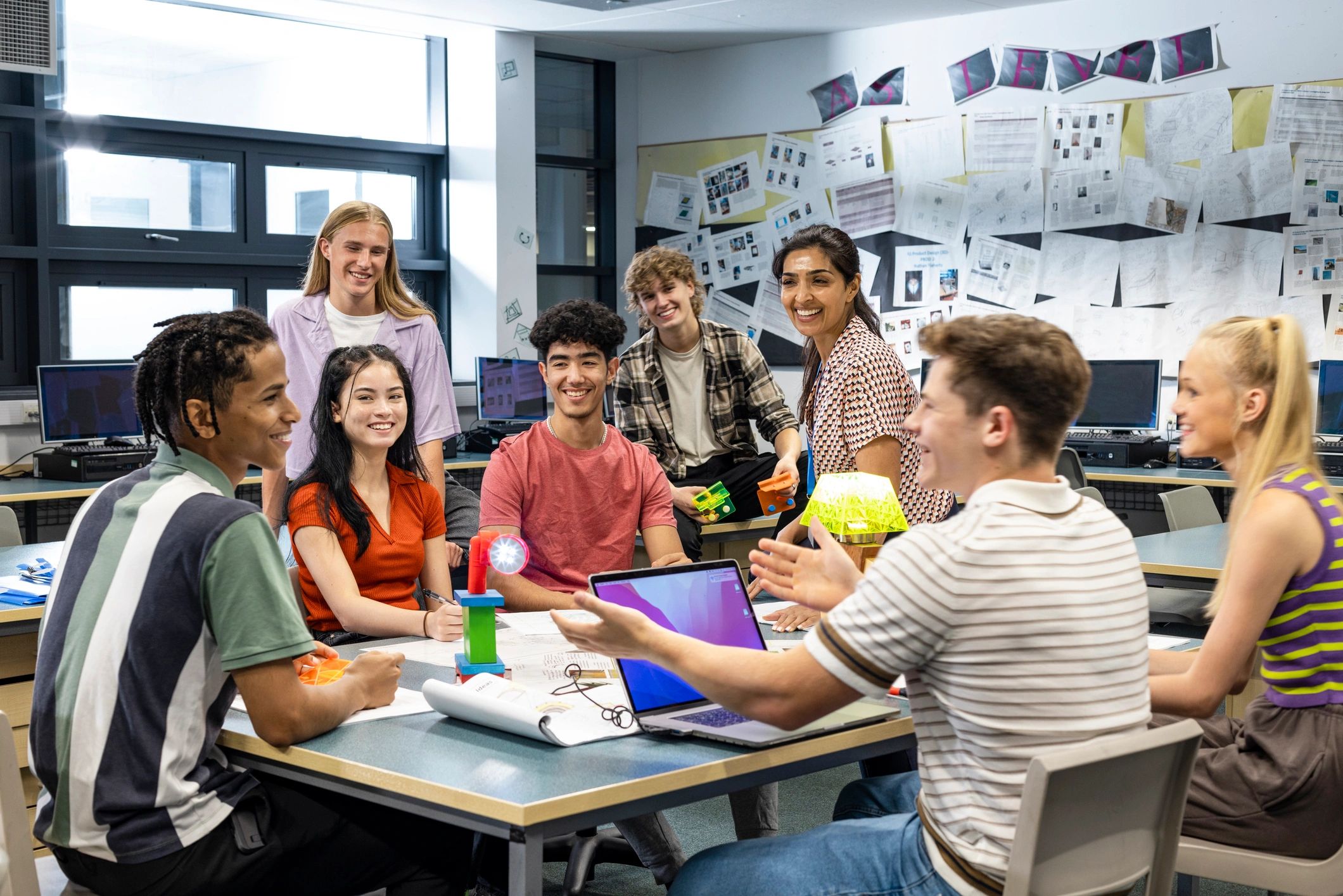 Black teenage boys learning together in a classroom