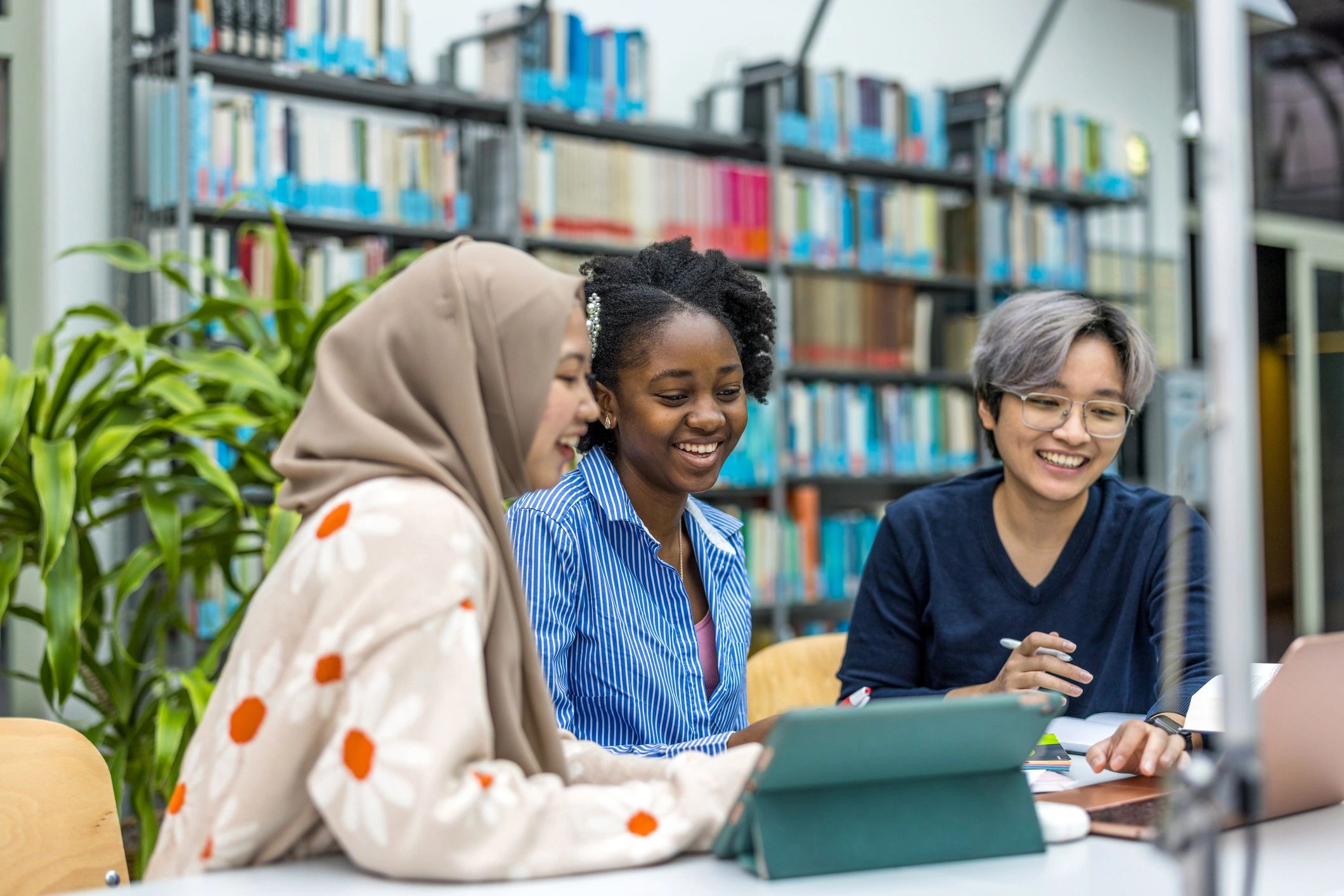Students studying together in a library