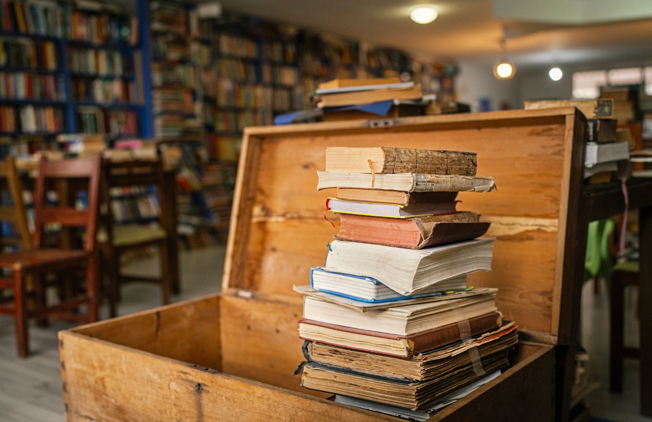 Books stored in a wooden chest